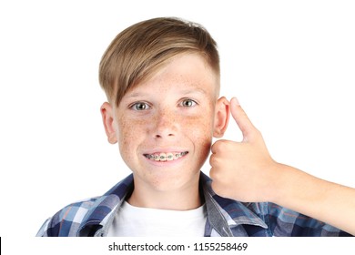 Young Boy With Dental Braces On White Background