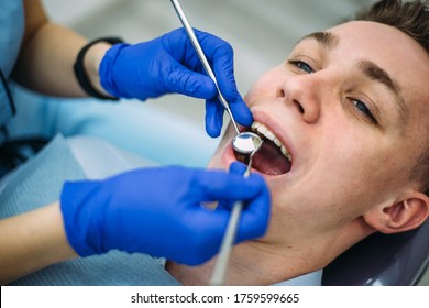 Young boy at the dentist consultation. Checking and dental treatment in a dental clinic. Oral hygiene and treatment.