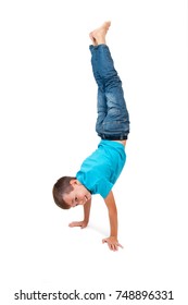 Young boy doing handstand 