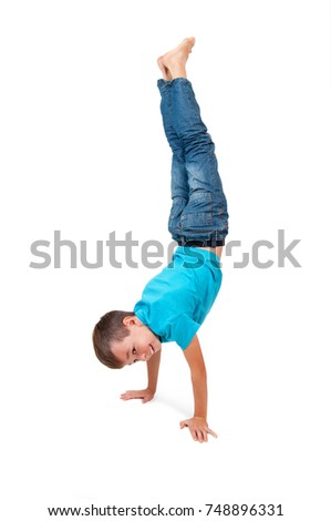 Young boy doing handstand 