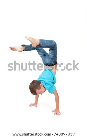 Young boy doing handstand 