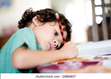 Young Boy Doing His Homework At Home.