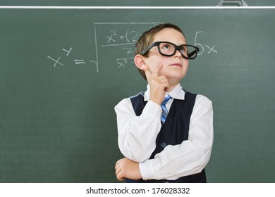 A Young Boy Dressed As A Math Nerd.