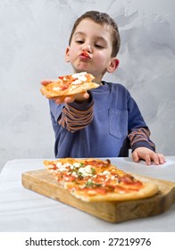 Young Boy Eating Homemade Pizza