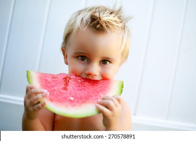 Young Boy Eating Watermelon