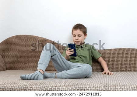 Similar – Little boy using a tablet