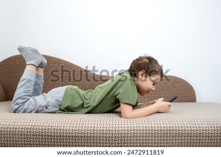 Similar – Little boy using a tablet