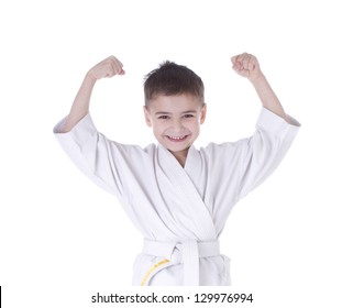 Young boy fighter in kimono with hand up isolated on white background