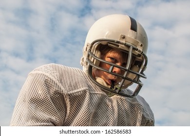 Young Boy In Football Helmet