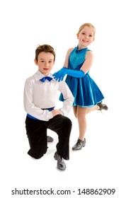 A Young Boy And Girl Tap Dance Partners In Recital Costume