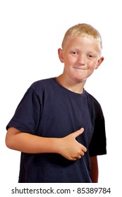 Young boy giving a thumbs-up sign with a satisfied smile.