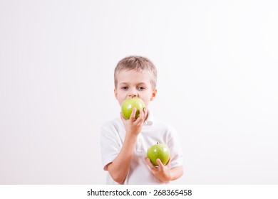 Young boy with green apple 