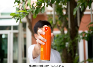 Young Boy Hand Holding Insect Spray Can Outdoor