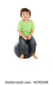 Young Boy Having Fun On Inflatable Hopper