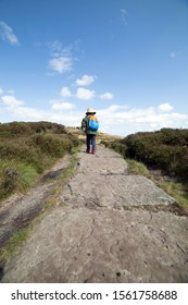 Young Boy Hiking Along The Paved Footpath On The Edges Of Kinder Scout, Edale, Peak District, England, UK