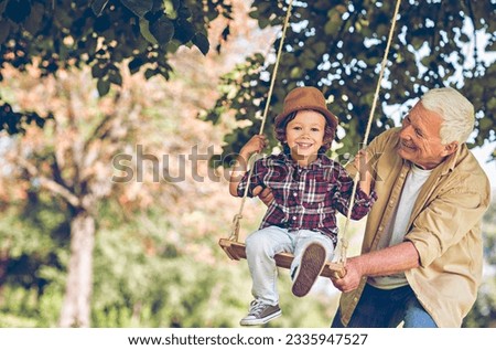 Similar – Image, Stock Photo Grandson on the swing (with a plaster on his knee)