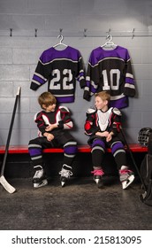 Young Boy Hockey Players Joke as Getting Dressed for Hockey Game
