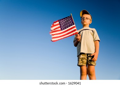 Young Boy Holding American Flag On Stock Photo 1629041 