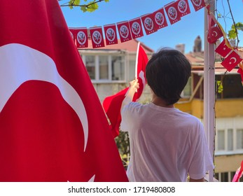 Young Boy Holding The Turkish Flag Celebrating The Turkey Independence Day.
