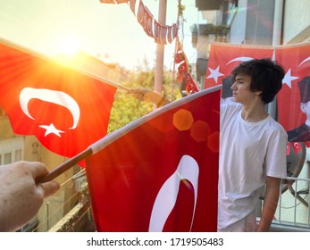 Young Boy Holding The Turkish Flag Celebrating The Turkey Independence Day.
