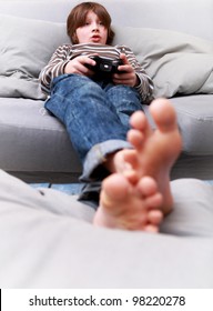 Young Boy With Joystick Playing Computer Game