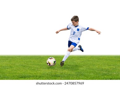 Young boy kicks a soccer ball on a grassy field, with a clean white background for easy text overlay. This versatile stock image is perfect for sports, fitness, or youth-focused content - Powered by Shutterstock