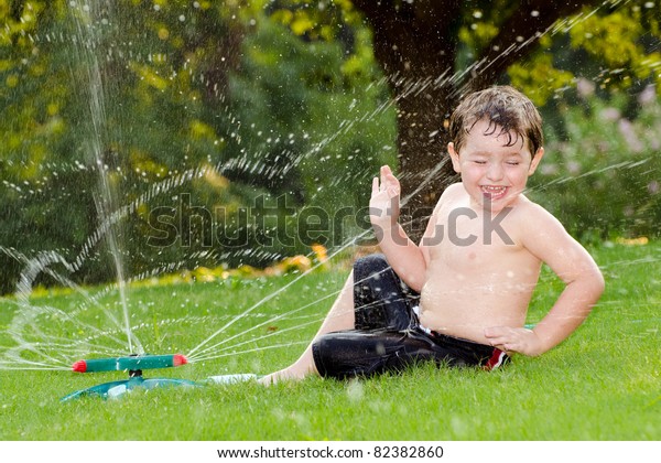 Young Boy Kid Cools Off By Stock Photo 82382860 | Shutterstock