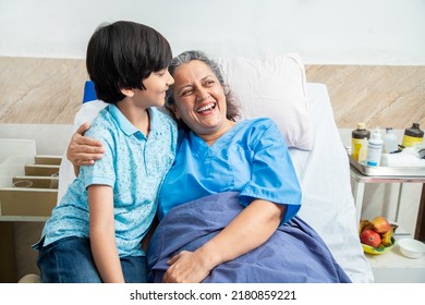 Young boy kid meet her old paralyzed granny at hospital, Elderly female patient spend time his grand son. both having fun and smiling.