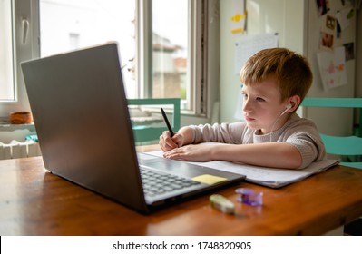 Young boy learning from home, online schooling - Shutterstock ID 1748820905