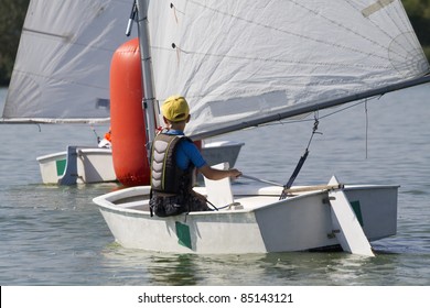 young boy learning to sail