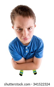 Young Boy Looking At The Camera From High Angle View With Mean Facial Expression. Isolated On White Background.