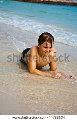 Similar – One happy little boy playing on the beach