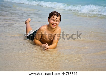 Similar – Image, Stock Photo Little boy doing exercise at beach