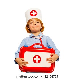 Young boy with medical cap and toy first-aid kit