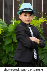 Young boy modeling with suit and tie outdoors