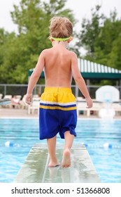 Young Boy On A Diving Board