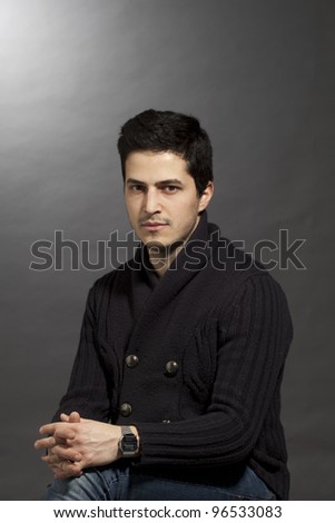 Similar – Young man with lost look in a modern pub.