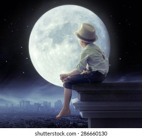 Young boy on a roof - Powered by Shutterstock