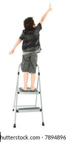 Young Boy On Step Ladder Reaching Up Over White Background.