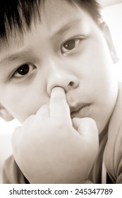 Young Boy Picking His Nose