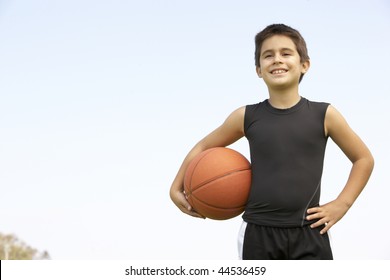 Young Boy Playing Basketball