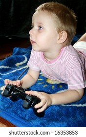 young boy is playing computergames