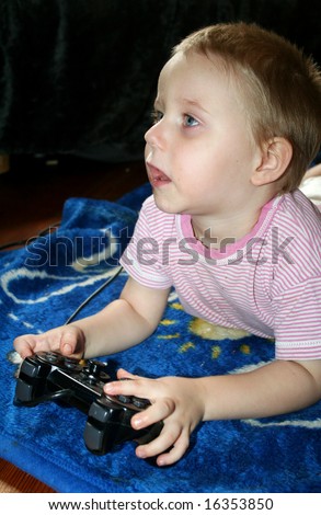 young boy is playing computergames