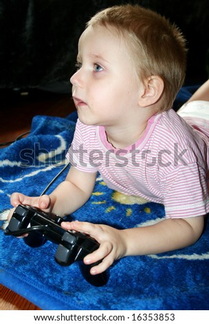 young boy is playing computergames