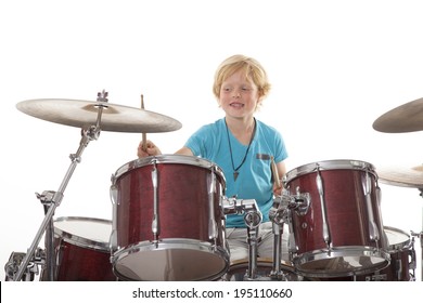 Young Boy Playing Drums Against White Background