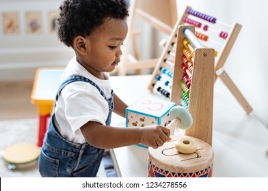 Young boy playing with educational toys