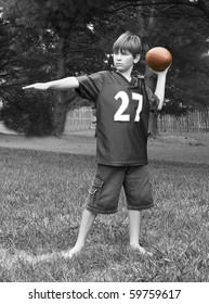 Young Boy Playing Football - Black And White Images Have Selected Color With Football