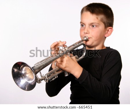 Young boy playing instrument