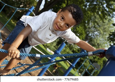 Young boy playing at a park - Powered by Shutterstock