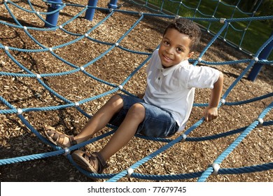 Young boy playing at a park - Powered by Shutterstock